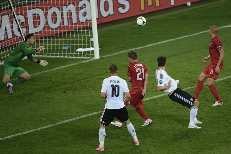 Germany's Mario Gomez heads the ball past Portugal's Rui Patricio at Euro 2012 on Saturday. (Anne-Christine Poujoulat/AFP/GettyImages) 