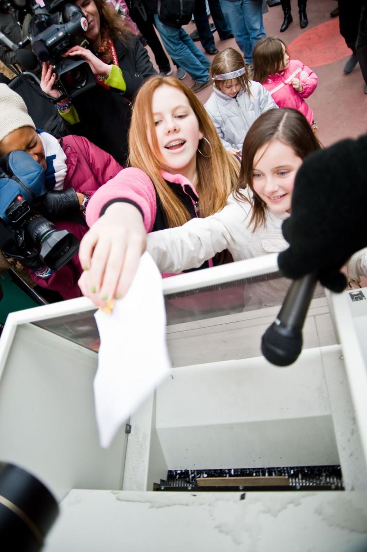 Two friends bid 'good riddance' to a falling out with a friend during the Third Annual Good Riddance Day in Duffy Square. (Aloysio Santos/The Epoch Times)