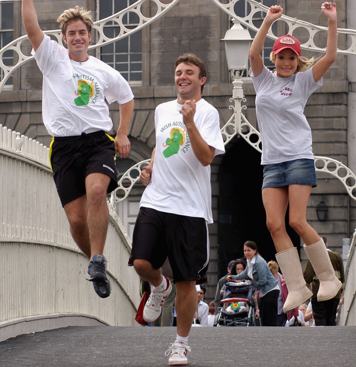 FOR A GOOD CAUSE: (L-R) Simon Casey, Jonathan Wilkes, Hayley Evetts and the rest of the cast from 'Grease' take part in a charity Fun Run from the Ha'Penny Bridge to The Point Theatre on August 10th, 2004 in Dublin, Ireland. Such runs are often organised by volunteer organisations