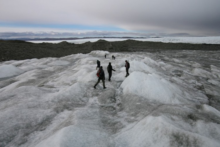 Tourists on the Greenlandic icecap on Sept. 3, 2007. Although 80 percent of Greenland is covered in ice, beneath the ice lies abundant natural resources, such as rare earth elements. (Uriel Sinai/Getty Images)