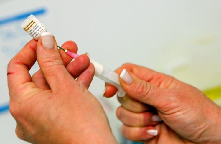 A nurse prepares a vaccine against swine flu on Nov. 12, 2009 in Nice, France. The Finnish National Institute for Health (THL) has proposed suspending vaccinations for H1N1 swine flu. (Valery Hache/AFP/Getty Images)