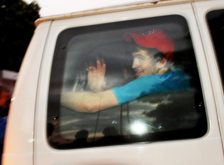 One of the American missionaries held in Haiti on charges of kidnapping children in the wake of last month's massive earthquake waves from the back seat of a van after they were released from jail on Feb. 17, and driven to the airport. Eight of the 10 Ame (Roberto Schmidt/AFP/Getty Images)