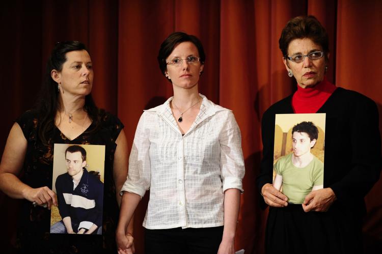 UNKNOWN FATES: Sarah Shourd (C), the American hiker released from detention in Iran last September stands at a press conference after her release with the mothers of two other hikers still in prison, Cindy Hickey (L), Shane Bauer's mother and Laura Fattal, Josh Fattal mother.  (Emmanuel Dunand/AFP/Getty Images)