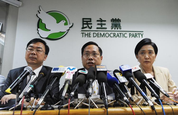 Democratic Party Chairman Albert Ho (C) speaks at a news conference in Hong Kong on May 24. The struggle for democracy in Hong Kong has hit a new level, as clashes erupted over proposed electoral reform. (Mike Clarke/Getty Images)