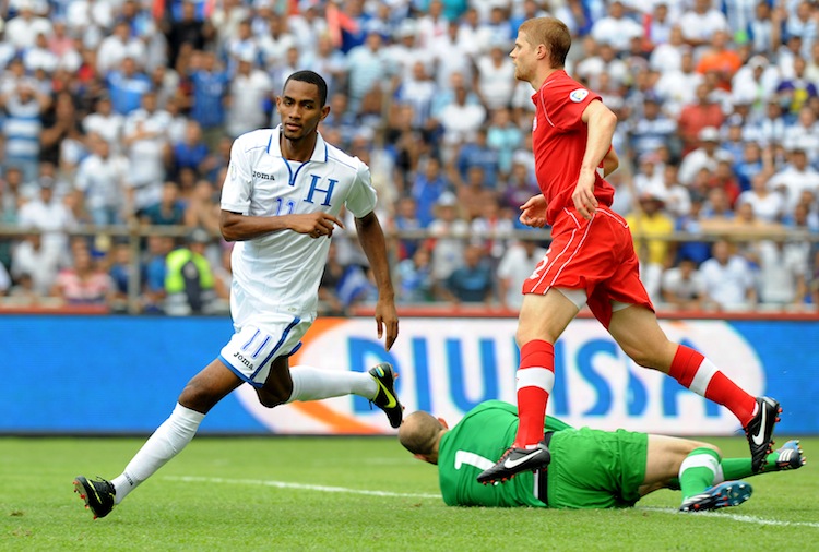 Jerry Bengtson (L) begins his celebration after scoring one of his three goals against Canada on Tuesday in World Cup 2014 qualifying in San Pedro Sula, Honduras. Honduras crushed Canada 8–1 eliminating the Canadians from World Cup qualification. (Orlando Sierra/AFP/Getty Images) 