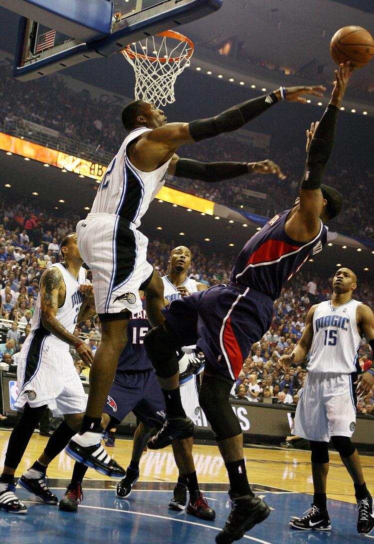 Dwight Howard (left) had another great outstanding game for the Orlando Magic on Thursday. (Doug Benc/Getty Images)