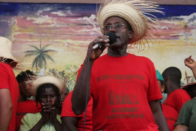 Jean Baptise Chavannes, leader of the MPP movement. His shirt says, in Creole, 'long live local corn, down with Monsanto, down with genetically modified and hybrid seeds.' (Alice Speri/Getty Images )