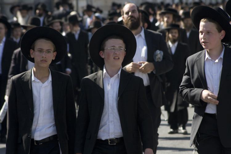 INTENSITY: Protesters descended on Jerusalem near the city center on June 17. They are protesting an Israeli Supreme Court decision to sentence to two weeks in detention parents who refuse to follow a court order requiring the integration of different ultra-orthodox sects in schools. (Genevieve Long/The Epoch Times)