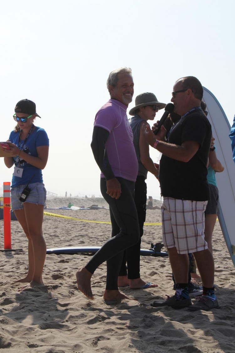 Gregory Harrison (L), TV and movie celebrity, is interviewed by PT Townend (R), a surfing legend, recalling the highlights of the day.  (Danielle Kaiser)