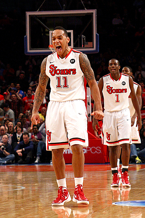 D'Angelo Harrison (11) is fired up after a big play Saturday against UCLA. (Chris Chambers/Getty Images)