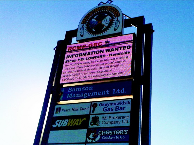 A billboard in Hobbema asks for information on the July 11 shooting death of 5-year-old Ethan Yellowbird. Samson Cree band leaders on the reserve are proposing a bylaw that could evict gang members and criminals from the troubled community.  (Justina Reichel/The Epoch Times)