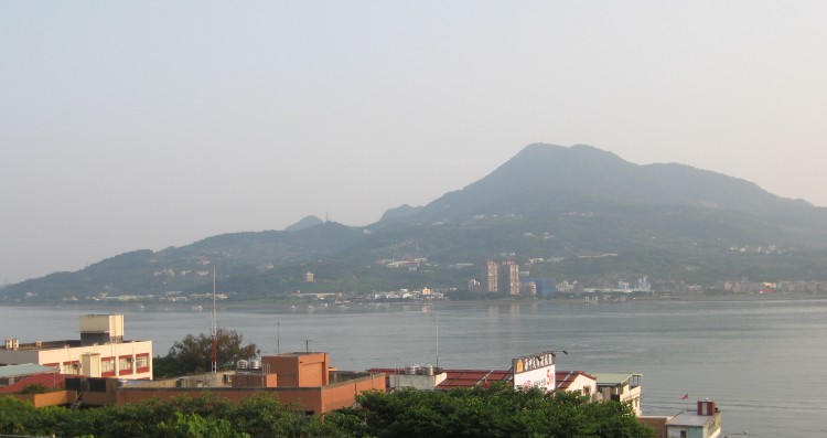 BLESSINGS OVER THE WATER: Goddess of Mercy Mountain viewed from across the Danshui River. (Arnaud Camu/The Epoch Times)