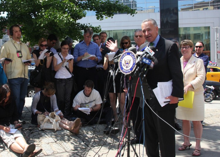 U.S. Sen. Charles Schumer speaks about inter-city bus safety from a Chinatown sidewalk Thursday. (Hannah Cai/The Epoch Times) 