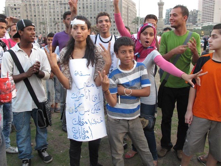 The sign reads: 'Egypt, I am sorry that I could not come [to demonstrate]. I had an exam.' (Yaira Yasmin/The Epoch Times)