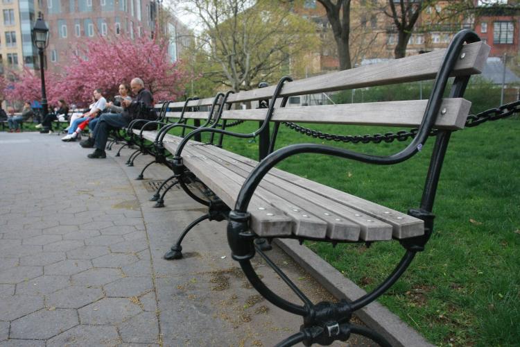 HOT SEAT: Pictured here on Monday, the benches in Washington Square Park are made of ipe, a tropical hardwood from the Amazon rainforest. New benches, also made from ipe, are set to be installed. (Tara MacIsaac/The Epoch Times)