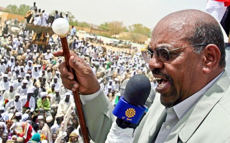 Sudanese President Omar al-Beshir addresses a rally during his visit to Zalingei in western Darfur on April 7, 2009.  (Ashraf Shazly/AFP/Getty Images)