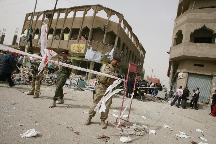 Iraqi police commandos secure the site of a rocket attack in Baghdad's al-Hurriyah neighborhood on March 4. Seven people were killed and 23 others were wounded in the attack according to medical and security sources. (Ali Al-Saadi/AFP/Getty Images)