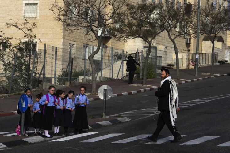 Israeli school children cross a street in Ramat Shlomo, a Jewish settlement in the mainly Arab eastern sector of Jerusalem. (Menahem Kahana/AFP/Getty Images)