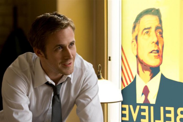 Ryan Gosling, as an up-and-coming campaign press secretary for the presidential candidate played by George Clooney, shown in the poster, during the last days before the Ohio presidential primary in 'The Ides of March.' (Saeed Adyani/Sony Pictures Entertainment Inc.)
