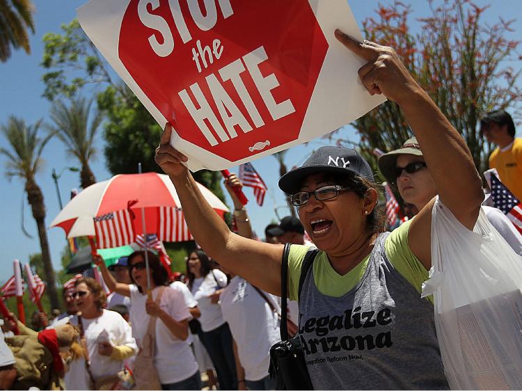 PROTEST: Opponents of Arizona's new immigration enforcement law protest outside the state Capitol building on April 25, 2010, in Phoenix, Arizona. (John Moore/Getty Images)