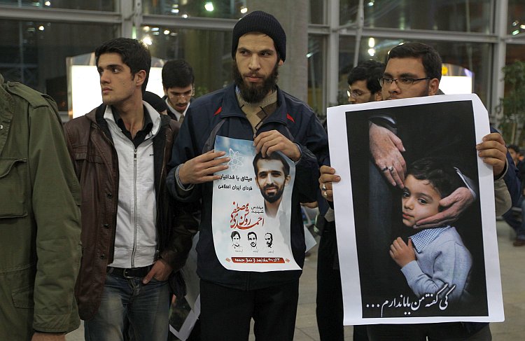 Iranian students hold photo of assassinated nuclear scientist Mostafa Ahmadi-Roshan