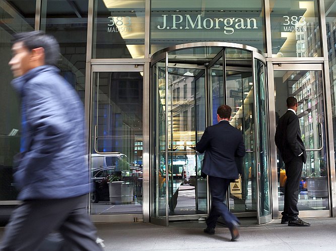 People pass the entrance to JPMorgan Chase & Co.'s headquarters in Manhattan, Oct. 2. JPMorgan Chase is one of eight U.S. banks on a 2011 global list of systemically important financial institutions (SIFI), according to the Financial Stability Board (FSB). (Spencer Platt/Getty Images)