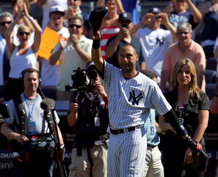 TIP OF THE CAP: Captain Derek Jeter salutes the crowd on Saturday June 9 at Yankee Stadium after collecting his 3000th hit in legendary fashion. (Michael Heiman/Getty Images )