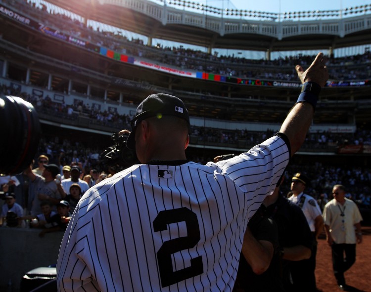 Jeter Sun: Yankees shortstop Derek Jeter acknowledges the crowd on Saturday afternoon after getting his 3000 hit against the Tampa Bay Ray at Yankee Stadium. After the game he said, 'I'm happy I've gotten all of these [hits] in a Yankee uniform.' (Nick Laham/Getty Images Sport)
