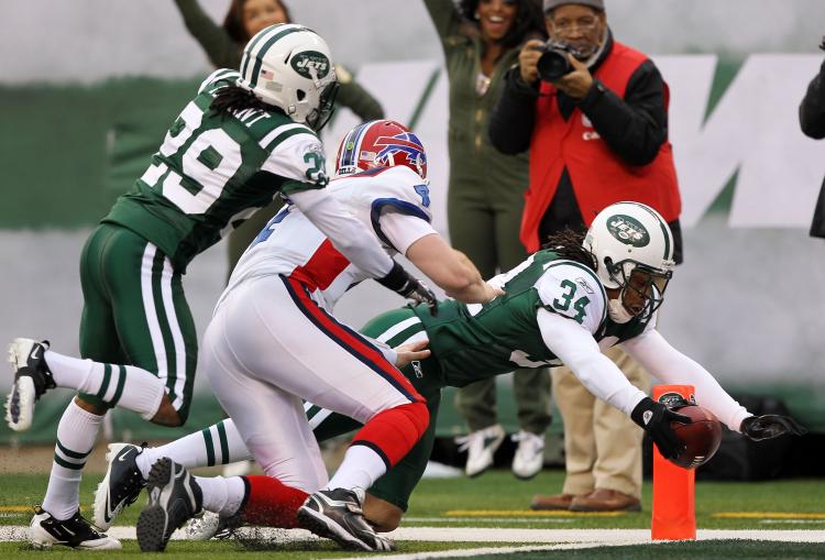 New York's Marquice Cole stretches to get in the end zone after picking off Buffalo quarterback Brian Brohm. (Al Bello/Getty Images)