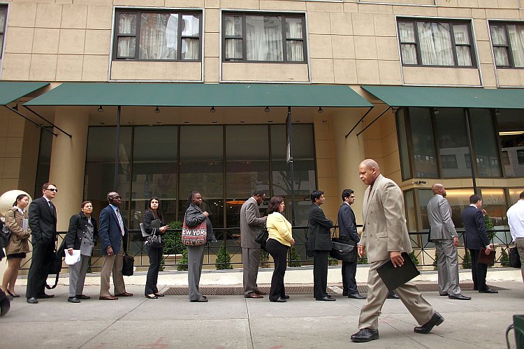 Job seekers line up to attend a job fair in New York City