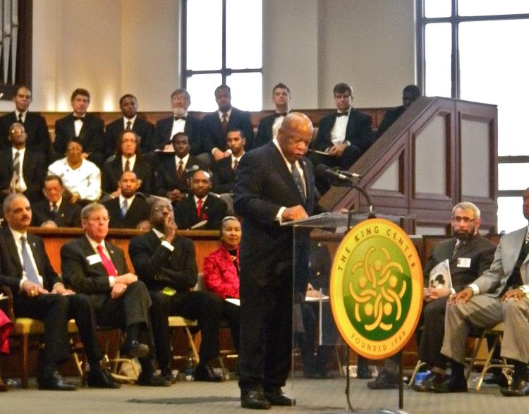 REMEMBRANCE: Congressman John Lewis speaks at Ebenezer Baptist Church as (L-R) Eric Holder, Johnny Isakson, Ebenezer Pastor Raphael Warnock and Xernona Clayton look on.  (Mary Silver/Epoch Times Staff)