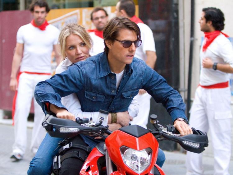 ACTION: Roy (Tom Cruise) and June (Cameron Diaz) race through the streets of Seville, Spain in the action comedy 'Knight and Day.' (Frank Masi/Twentieth Century Fox)