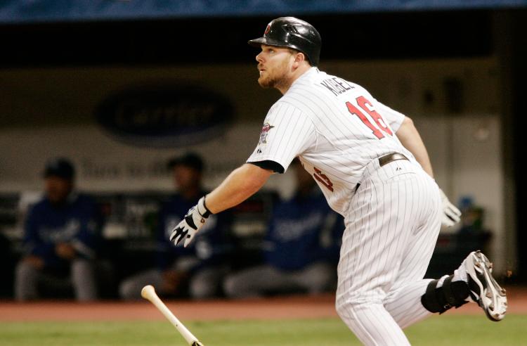 GONE: Minnesota's Jason Kubel watches his second three-run homer of the game leave the park in the third inning.  (Genevieve Ross/Getty Images)