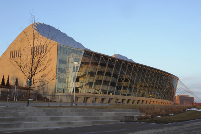 Entrance of Kauffman Center for Performing Arts with lobby stairs seen through the glass windows. (Photo by Cat Rooney)