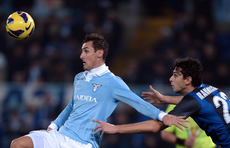 Lazio's Miroslav Klose fends off Inter Milan's Andrea Ranocchia in Serie A action on Sat. Dec. 15 in Rome. (Filippo Monteforte/AFP/Getty Images) 