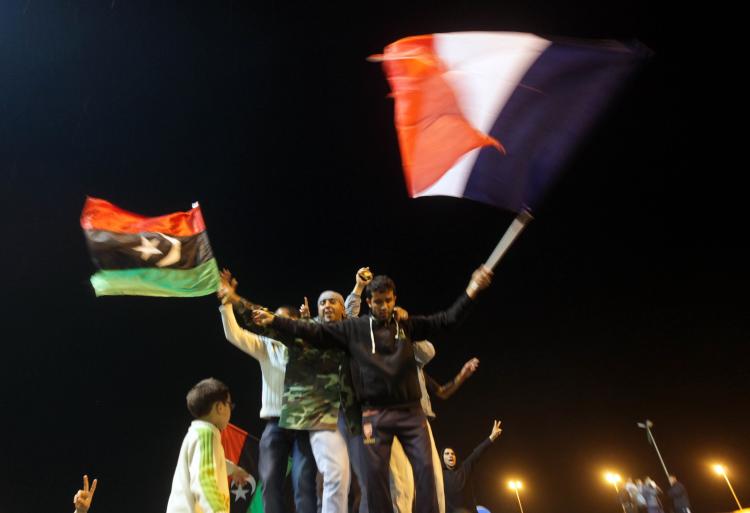 RELIEF: Libyans in the besieged city of Benghazi celebrate a vote of the United Nations Security Council that adopted a resolution that will impose a no-fly zone over Libya.  (Patrick Baz/Getty Images)