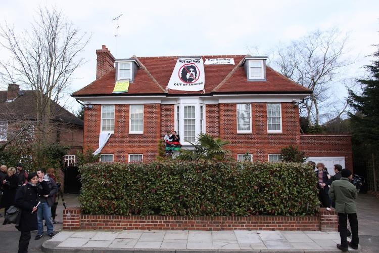 COMMANDEERED: Squatters demonstrate outside the London house of Saif al-Islam Gadhafi, Moammar Gadhafi's son, on March 9. Libyan squatters have taken control of the $17 million house on behalf of the Libyan people, they say.  (Oli Scarff/Getty Images)