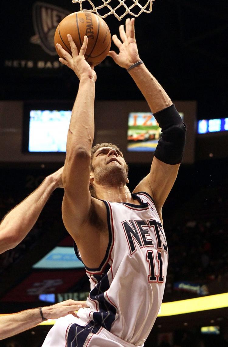 Brook Lopez led the New Jersey Nets to their 10th win, avoiding the record for worst season NBA season. (Jim McIsaac/Getty Images)
