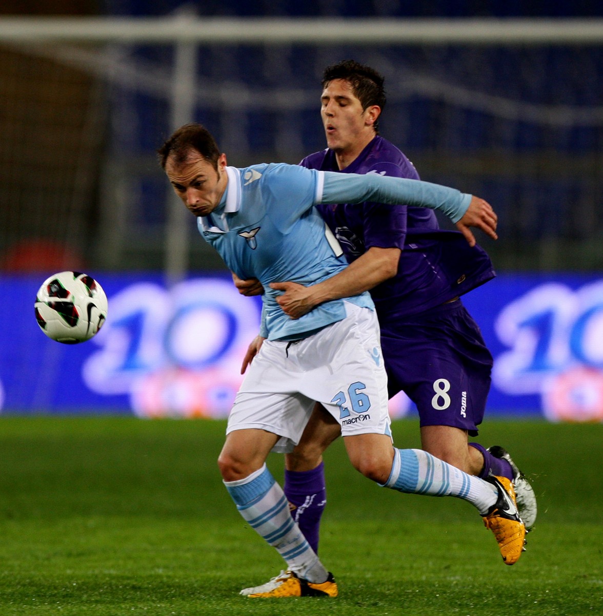 Fiorentina goal scorer Stevan Jovetic holds back Lazio's Stefan Radu in Serie A action at Stadio Olimpico in Rome on Mar. 10. (Paolo Bruno/Getty Images) 