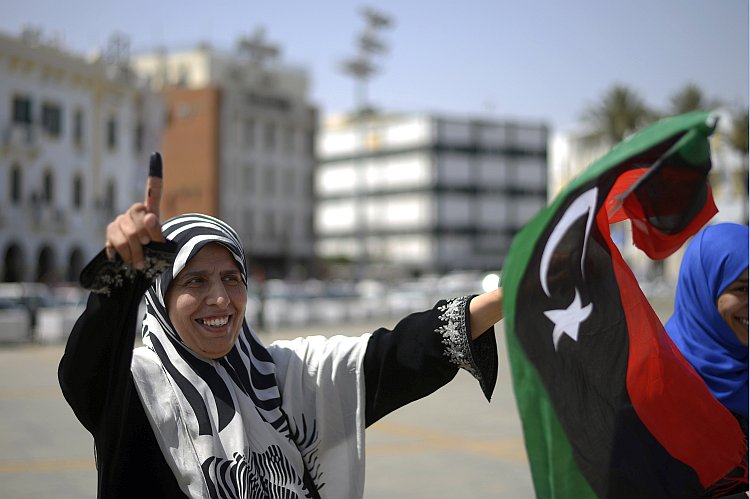 A Libyan woman celebrates in Martyrs' Square in Tripoli