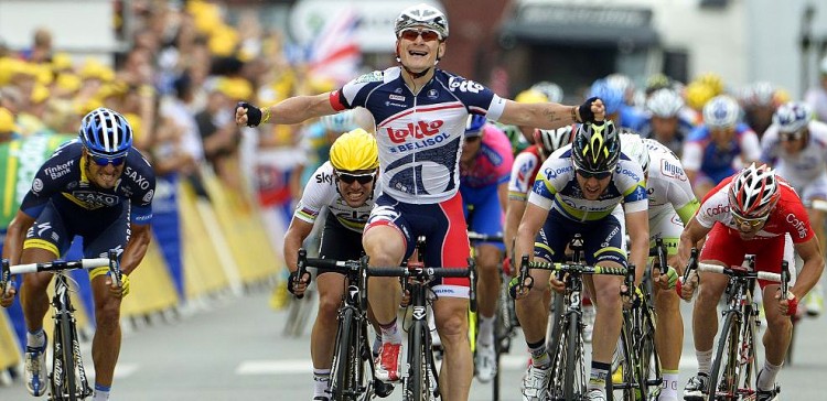 André Greipel of Lotto-Belisol celebrates as he wins Stage Five of the 2012 Tour de France ahead of Mark Cavendish (2L-yellow helmet) of Sky Procycling in fifth place and Matt Goss (2R-blue/yellow helmet) of Orica-GreenEdge in second. (lottobelisol.be)