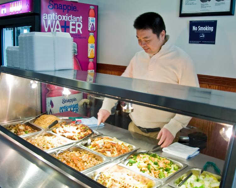FREE LUNCH: Ben Lee, owner of V33 Golden City, gets ready to offer free lunch on Wednesday.  (Aloysio Santos/The Epoch Times)