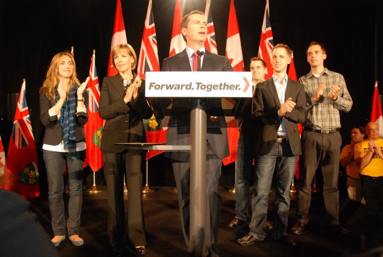 Premier and Ontario Liberal Party Leader Dalton McGuinty celebrates his party's win in the Oct. 6 provincial elections with his wife and four children on stage.  (Grace Dai/The Epoch Times)