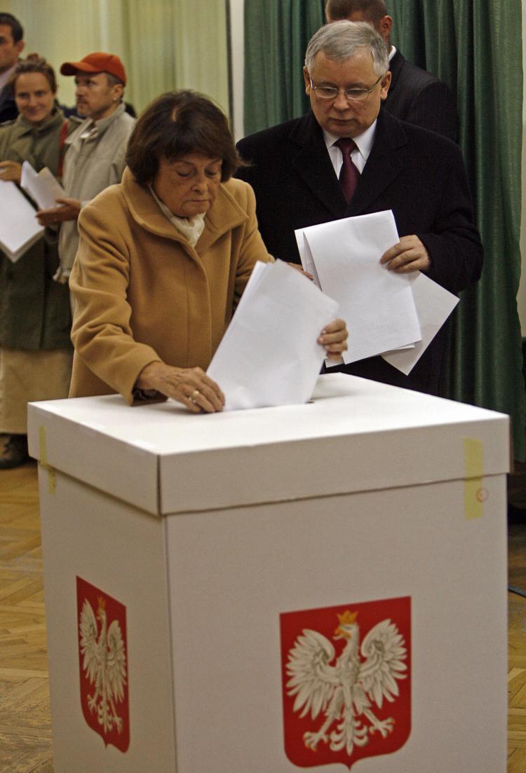 Polish Prime Minister Jaroslaw Kaczynski watches and his mother Jadwiga cast her ballot at a polling station in Warsaw for the general elections 21 October 2007. Jaroslaw told his mother Wedneday that his twin President Lech Kaczynski, was killed in a pla (Janek Skarzynski/Getty Images)
