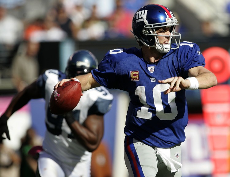 Eli Manning rears back to pass against Seattle last week. The Giants' quarterback had a season-high three interceptions against the Seahawks and can't have a duplication of that performance if they're going to win Sunday. (Rick Schultz/Getty Images)