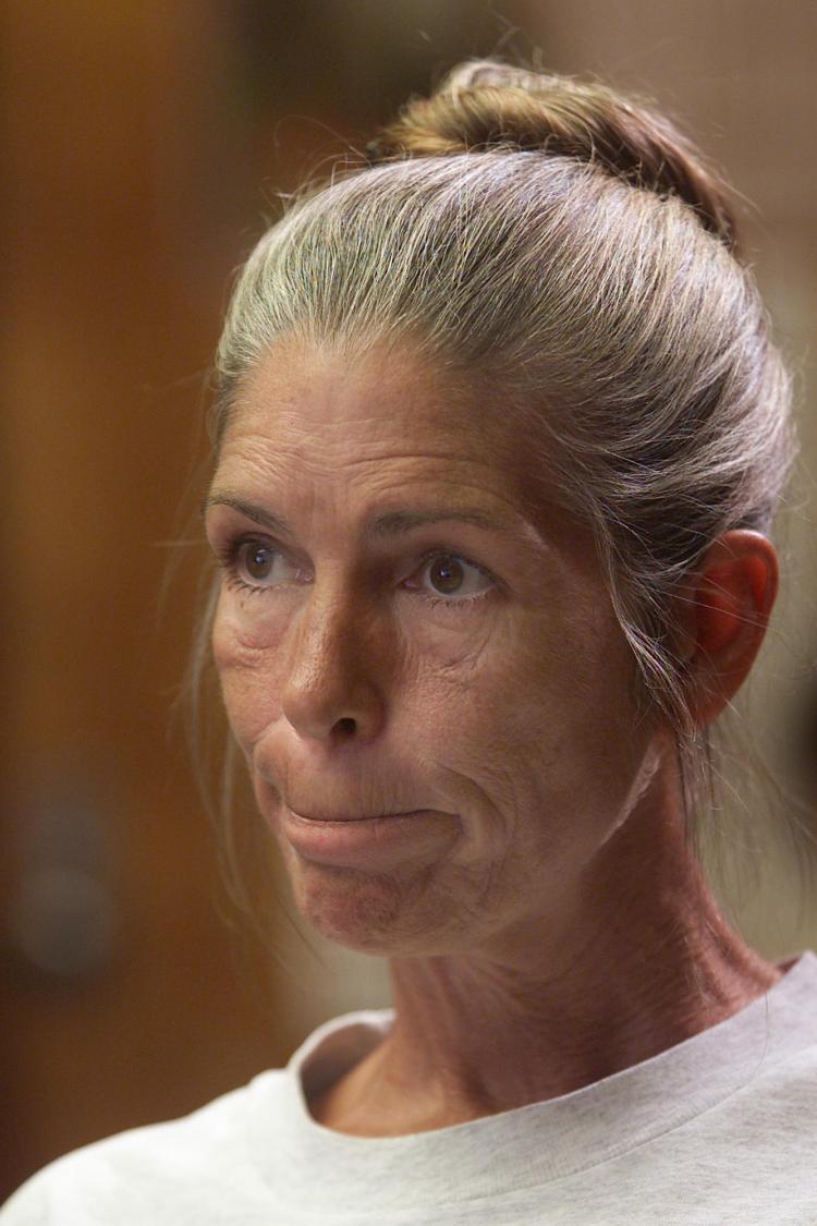 Former Manson family member Leslie Van Houten reacts as members of a California prison board declare her parole denied, 28 June, 2002. (Damian Dovarganes/Getty Imgaes)