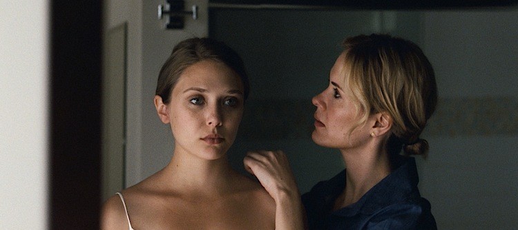 (L-R) Elizabeth Olsen as a young woman haunted by painful memories and increasing paranoia after leaving a cult, seeking help from her sister, played by Sarah Paulson, in the drama 'Martha Marcy May Marlene.' (Drew Innis/Twentieth Century Fox Film Corporation)