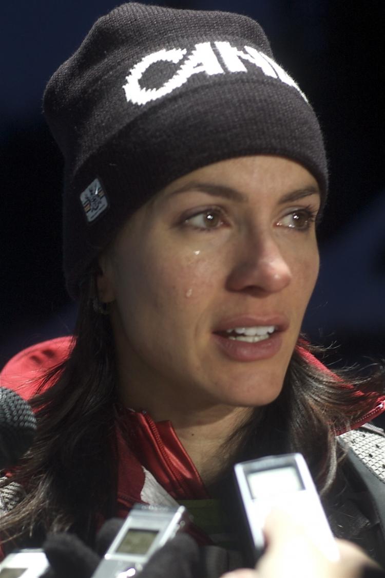 Canada's medal-hopeful Mellisa Hollingsworth speaks of the heartbreak of her last run of the women's skeleton as she leaves the track on Friday.  (Matthew Little/The Epoch Times)