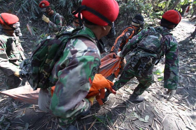 Mount Merapi rescue workers recover more victims from ash-covered villages near the volcano. The death toll is expected to keep rising as search and rescue efforts continue. (K. Mulis/The Epoch Times)