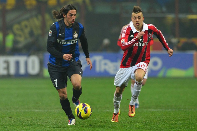 Inter's Ezequiel Schelotto (L) challenges for the ball with AC Milan's Stephan El Shaarawy in the Milan derby played on Feb. 24. (Giuseppe Cacace/AFP/Getty Images) 